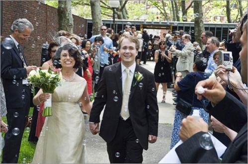 Deifik and Schuller stroll down the receiving line outside the chapel after the ceremony.