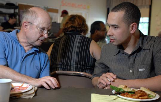 Efforts to help immigrants have brought congregations together. Walter Ciesluk (left), a member of Aldersgate United Methodist Church in Chelmsford, spoke with Danny Nunez of Methuen, a member of Ebeneezer Christian Church in Lawrence, at a recent gathering.
