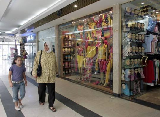 Some Palestinian shoppers ignored the raid by Israeli forces of a popular shopping mall in the occupied West Bank yesterday.