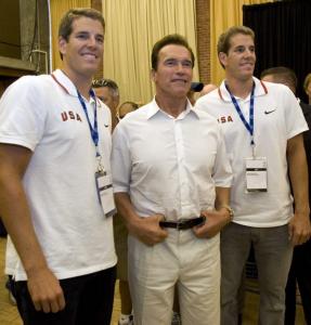 Tyler (left) and Cameron Winklevoss, posing with Arnold Schwarzenegger, hope to terminate the competition in Beijing. Tyler (left) and Cameron Winklevoss, posing with Arnold Schwarzenegger, hope to terminate the competition in Beijing.
