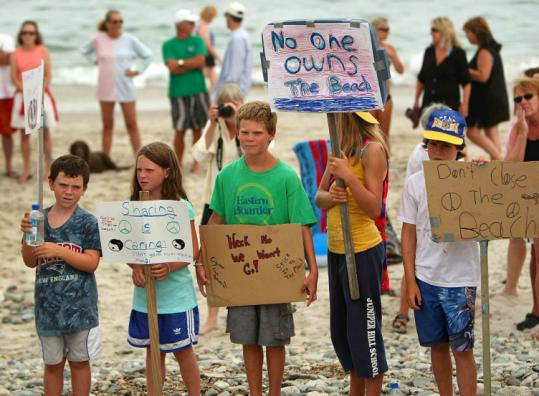 Children of Marshfield residents who live near Rexhame Beach protested yesterday where access may be limited to the public if a ruling favors residents whose property abuts the beach.