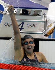 Rebecca Soni checks out her world-record time after winning gold in the 200-meter breaststroke.