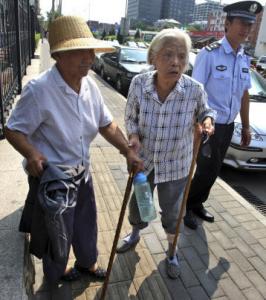 Wu Dianyuan, 79, center, and Wang Xiuying, 77, wanted to protest during the Olympics.