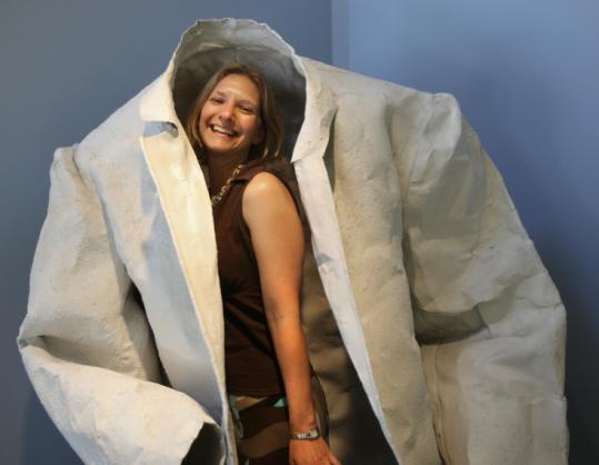 Lisa Lynch, curator of the art exhibit ''Dress Redress'' at Brandeis University, with Leslie Wilcox's ''Sport Coat.''