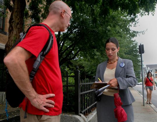 Volunteer George Anastos spoke with state Senate candidate Sonia Chang-Diaz, a former schoolteacher, in Jamaica Plain.
