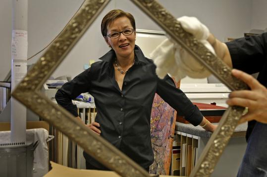 Owner of Fastframe in Brookline Hsiu-Lan Chang will be naturalized Wednesday during a large ceremony at Fenway Park.
