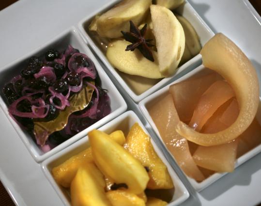 Among fruits that hold up well to pickling are (clockwise, from upper left) blueberries, apples, watermelon rind, and peaches.