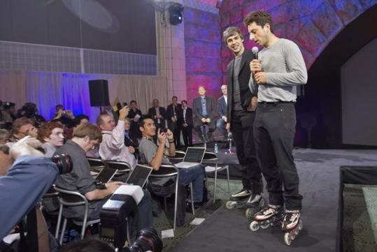 Google founders Larry Page (left) and Sergey Brin show off the G1 cellphone yesterday in New York.