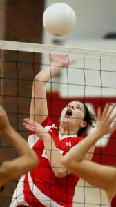 Melrose High School's Hannah Brickley, a team captain, spikes the ball during a game at Watertown High last week.