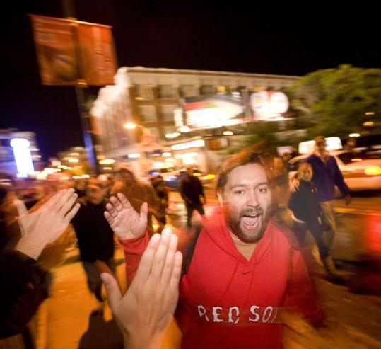 Red Sox fans celebrate outside Fenway Park after the win over the Los Angeles Angels last night.