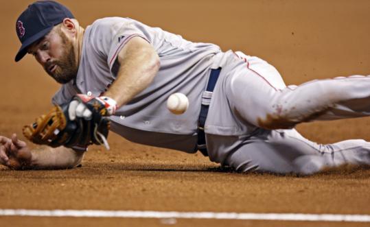 Kevin Youkilis held B.J. Upton to an infield single by knocking down his shot in the eighth.