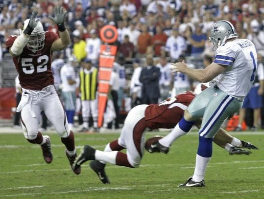 Two ex-Patriots had a hand in beating Dallas in OT - Sean Morey blocked Mat McBriar's punt, and Monty Beisel (52) took the ball into the end zone.