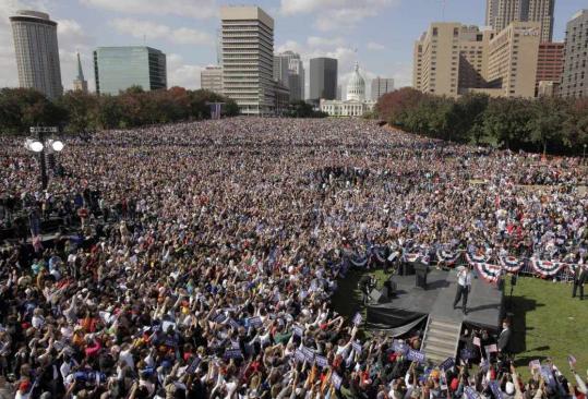Barack Obama's rally at the Gateway Arch in St. Louis yesterday drew an estimated crowd of 100,000. Obama called his rival, John McCain, out of touch for likening tax cuts to ''welfare.''
