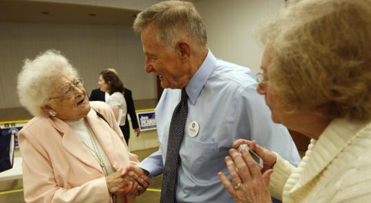 Marjorie Riggs (left) greeted former senator Birch Bayh of Indiana at the Blackford County 4-H building in Hartford City last week. Bayh, who is the father of Senator Evan Bayh of Indiana, talked to a group of Democratic loyalists about going to the polls.
