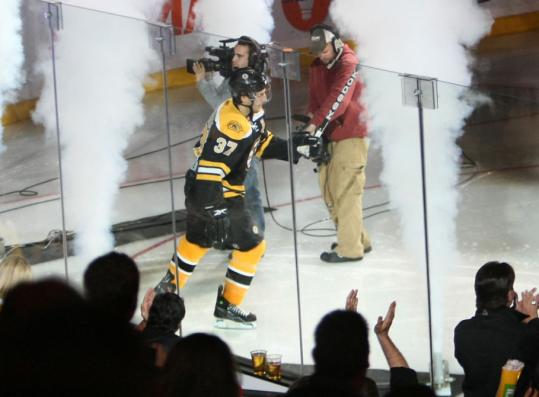 At last night's Bruins home opener, Patrice Bergeron made a smoking-hot entrance before a Garden crowd that was all fired up to see him again.