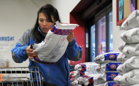 A customer loaded a bag of rice into her shopping cart at Uwajimaya Asian supermarket in Beaverton, Ore., recently.