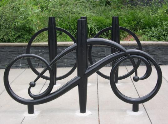 Four racks by artist Richard Duca, installed next to the Honan-Allston Branch Library, were dedicated in 2006.