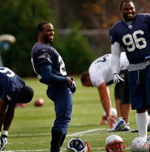 Deltha O'Neal (left), who suffered a head injury against the Rams Oct. 26, and Adalius Thomas share a laugh at practice.