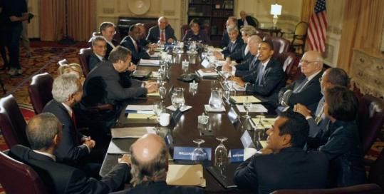 Former Harvard president Lawrence Summers (center left), with Barack Obama and other advisers yesterday.