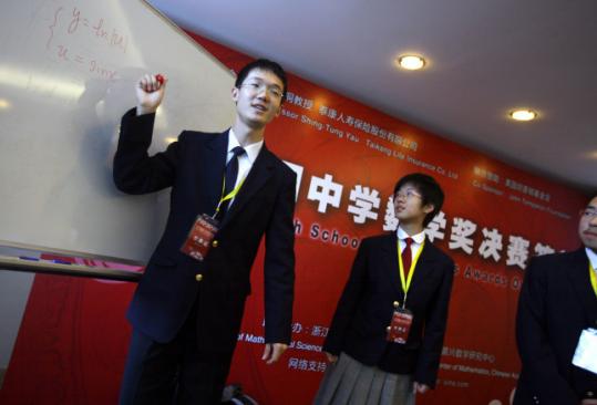 Students Li Taibo and Zhao Xinyue sought the attention of US admissions deans at a Beijing math competition.