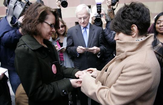 Jennifer Vickery (left) and Peg Oliveira were the first couple yesterday to wed under Connecticut's same-sex marriage ruling.