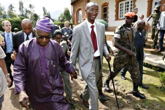 UN envoy Olusegun Obasanjo (left) held hands with rebel leader Laurent Nkunda as they met in Jomba yesterday.
