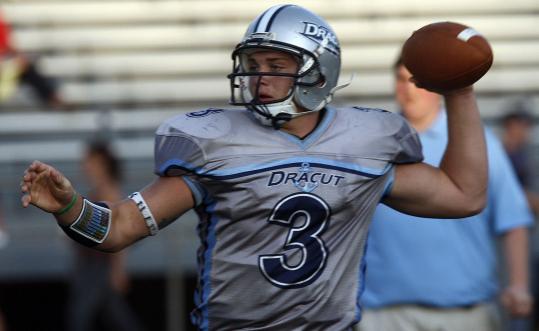 Dracut QB Matt Grimard wears a bracelet on his wrist and a band above his 