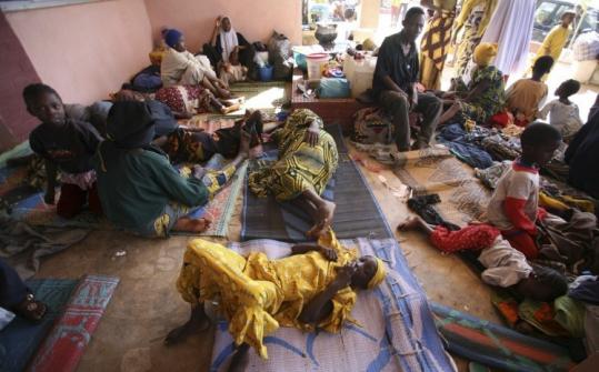 Nigerians displaced by religious clashes sought refuge at a displacement center yesterday in the central city of Jos.