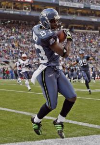 Seattle's Deion Branch scores the first of his two touchdowns against his former team.