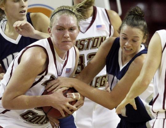 BC's Carolyn Swords (left) battles with UNH's Amy Simpson.