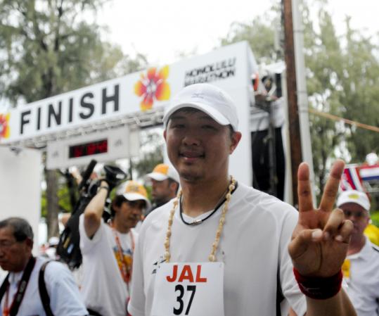 Ronen zilberman/Associated PressIn his marathon debut, Hideki Okajima may have been slow on the delivery (6 hours 35 minutes) but he accomplished his goal.