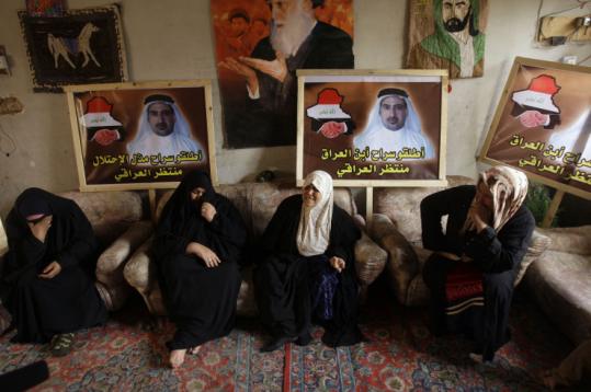 Family members gathered yesterday at the home n Baghdad of Muntader al-Zaidi, who threw his shoes at President Bush.