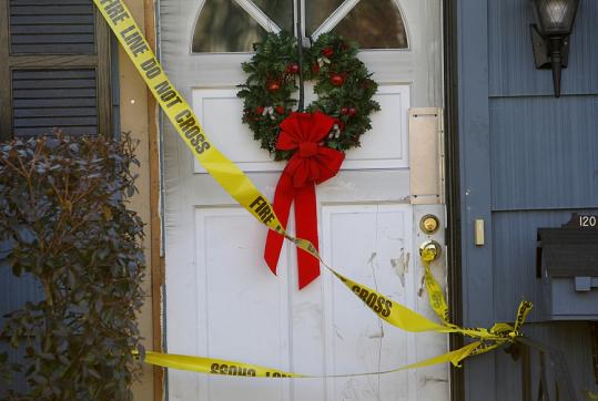Police tape was draped over the door of the Bourne home of Leo and Marion Gagnon, who died in a fire that horrified neighbors and relatives.