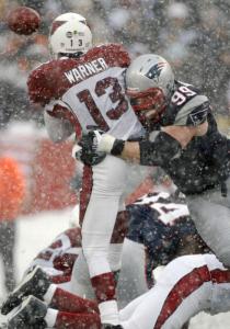 Just a month ago, snow and Patriot defenders were raining down on Kurt Warner. On Sunday, confetti was falling on Warner after his Cardinals won the NFC title.