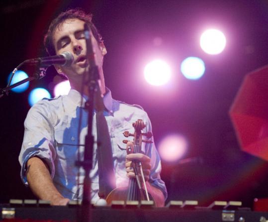 When performing alone, musicians like Andrew Bird (pictured) and Joseph Arthur record snippets of sounds to layer on top of one another for a full-band effect.