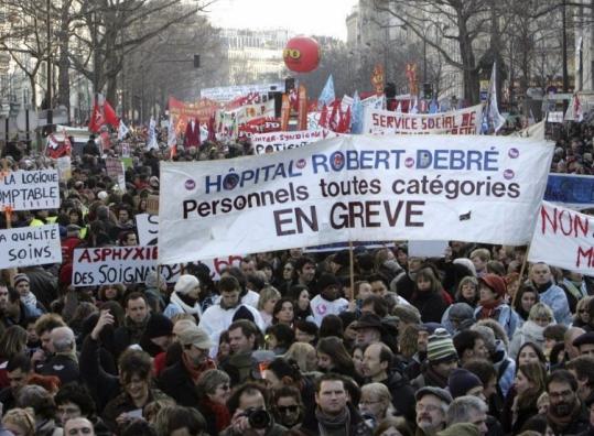 Demonstrators marched yesterday in downtown Paris, part of a nationwide protest organized by labor unions.