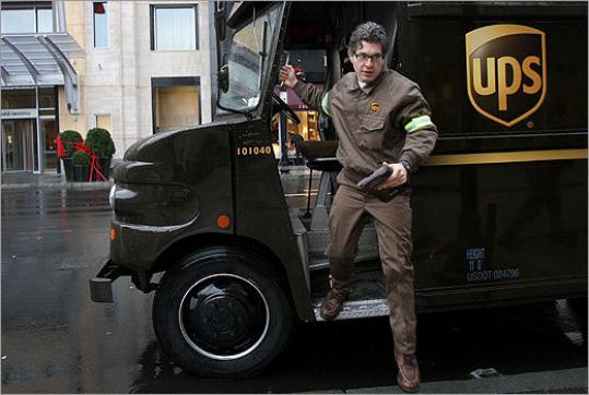 Geoff Edgers hustles to keep up with UPS deliveries on Boylston Street.