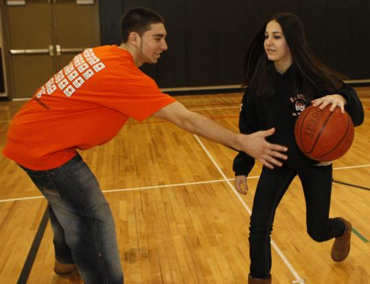 Oliver Ames senior Mike Byron and his sister, Jennifer, a freshman, go one-on-one.