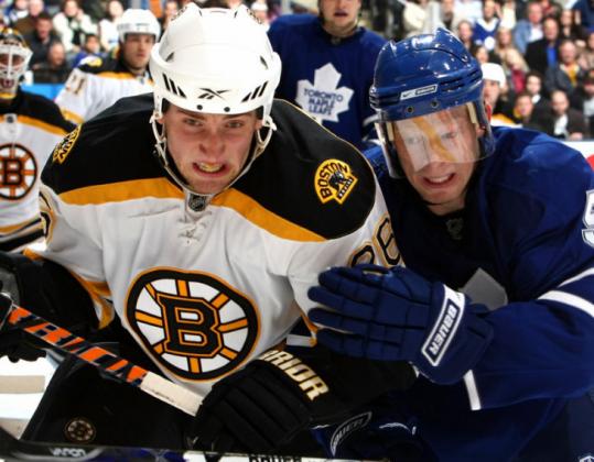Toronto's Jason Blake had his hands full with Bruin Blake Wheeler, who gave the Bruins a 7-4 lead in the second period.