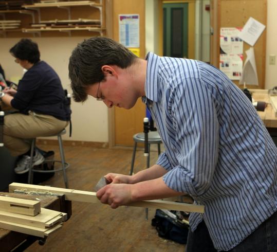 Kevin Hopkins, laid off last year from his job as a software engineer, is taking a three-month intensive furniture making workshop at the North Bennet Street School.