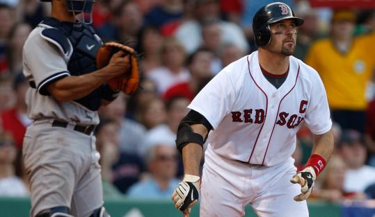 Jason Varitek watches his fourth-inning grand slam, a key hit in the Sox' slugfest win.