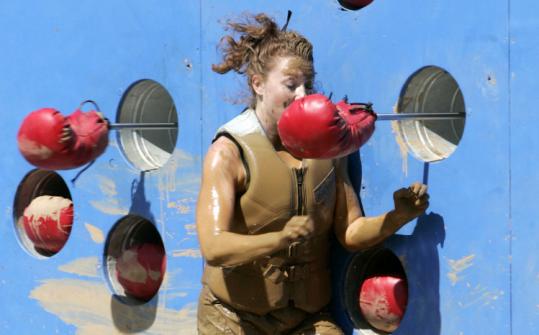 ADAM LARKEY/ABC VIA AP/FILEThe boxing glove section is one of many bruising elements of the Qualifier, the obstacle course for the ABC show ''Wipeout.''