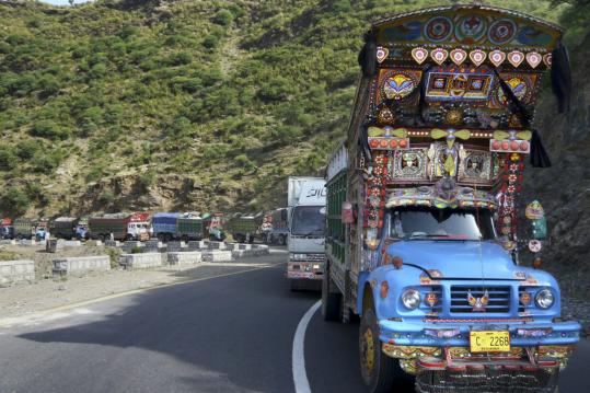 Truck carrying relief goods headed toward Mingora, the main town in Pakistan's Swat Valley, yesterday. Pakistani officials said their soldiers had forced the Taliban from the town.