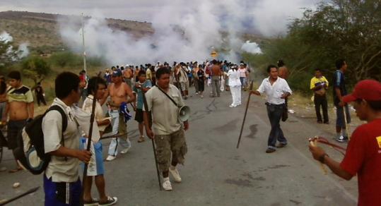Demonstrators rallied under clouds of tear gas fired by police yesterday at a road blockade in Bagua, north of Lima.