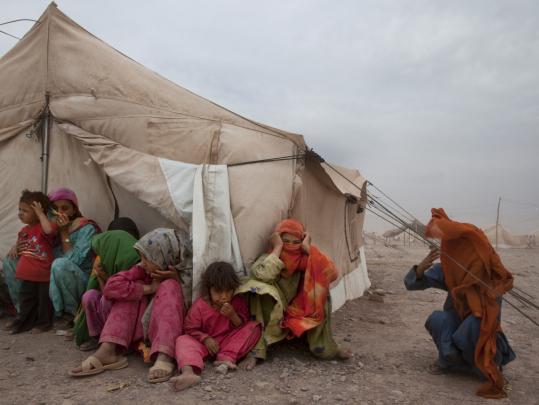 Displaced Pakistanis must fight severe wind and dust conditions at the Jalozai refugee camp. Fighting between the military and the Taliban have driven nearly 3 million from their homes.