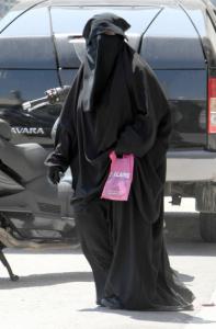 A Muslim woman in Marseille wore a niqab, which exposed only her eyes. Some in France want to ban such garments.