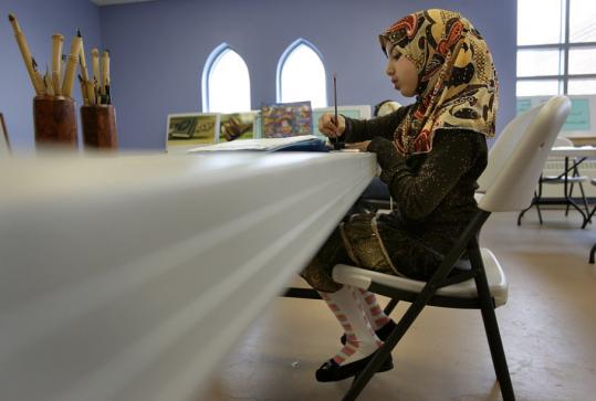Nine-year-old Sarah Erritouni of Revere was busy learning calligraphy yesterday at the Islamic Society of Boston Cultural Center in Roxbury.