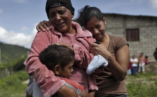 Silvia Mencillas (center) was comforted by relatives in Tegucigalpa yesterday. Witnesses said her son was shot to death Sunday by army troops during a demonstration.