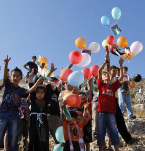 Palestinian children released balloons during a protest in the West Bank village of Burin against confiscation of land by Jewish settlers from a nearby settlement.
