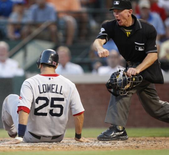 Red Sox third baseman Mike Lowell was a sitting duck after getting thrown out at home to end the fourth inning.